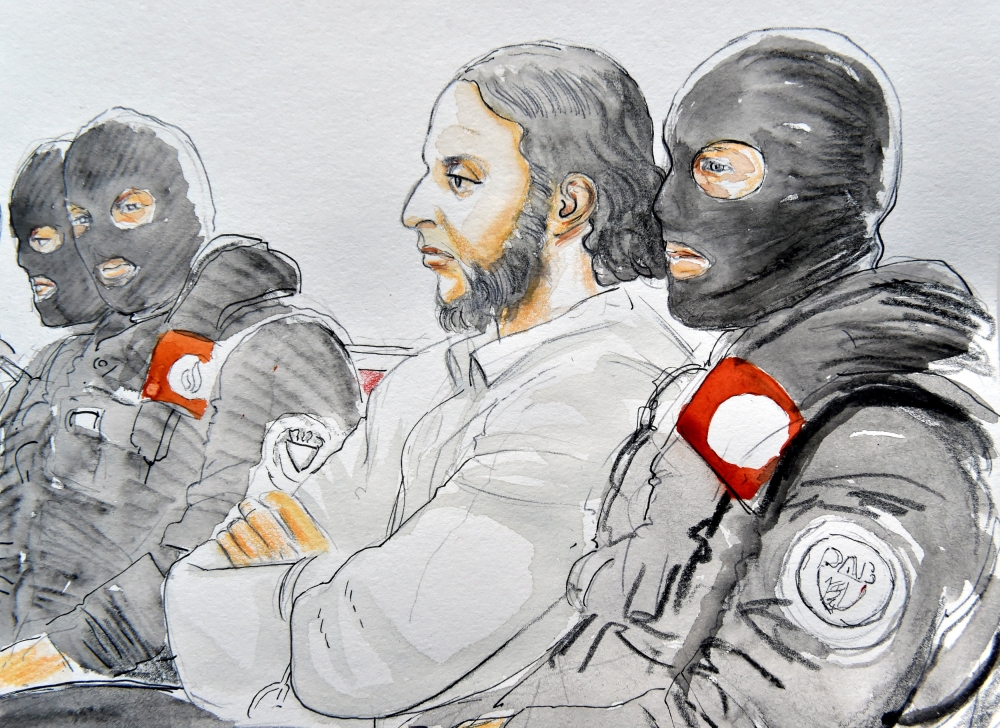 A court artist drawing shows Salah Abdeslam, one of the suspects in the 2015 Islamic State attacks in Paris, in court during his trial in Brussels, Belgium, February 5, 2018. Reuters/Yves Capelle