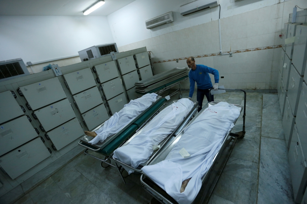 Bodies of Pakistani migrants who died when a boat sank off Libya's western coast, are seen in Tripoli Central Hospital in Tripoli, Libya, February 7, 2018. REUTERS/Ismail Zitouny