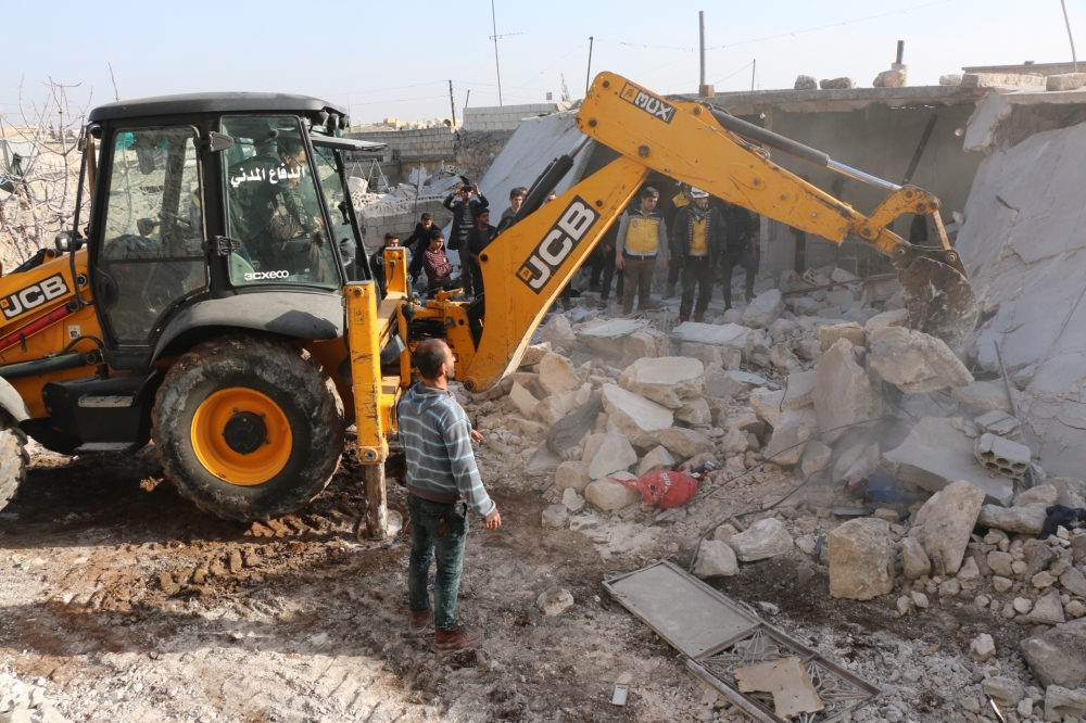 Members of Syrian NGOs conduct search and rescue operation amid debris after Assad Regime carried out an airstrike over Has village located at Syria's Idlib, which is a de-escalation zone, on February 09, 2018. Following the attack, 15 civilian lost their