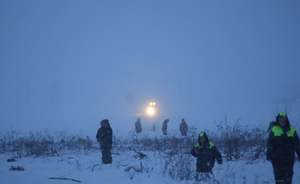 Emergency services work at the scene where a short-haul regional Antonov AN-148 plane crashed after taking off from Moscow's Domodedovo airport, outside Moscow, Russia February 11, 2018. REUTERS/Maxim Shemetov