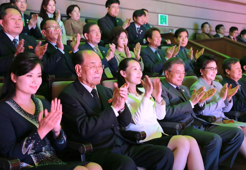 This photo taken on February 11, 2018 by North Korea's official Korean Central News Agency (KCNA) shows South Korea's President Moon Jae-in (3rd R), North Korean leader Kim Jong Un's sister Kim Yo Jong (3rd L) and North Korea's ceremonial head of state Ki