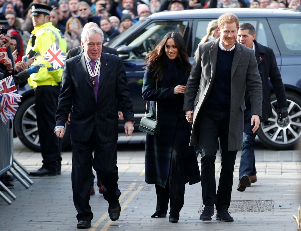Britain's Prince Harry and his fiancee Meghan Markle arrive for a visit to the Social Bite, a social business and cafe, in Edinburgh, Scotland February 13, 2018. REUTERS/Andrew Yates