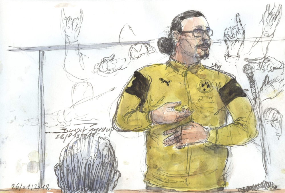 In this courtroom sketch created on January 26, 2018, at the palais de Justice court in Paris, shows Jawad Bendaoud gesturing while standing in the dock during his trial in which he stands accused of harbouring two of the jihadists in the aftermath of the