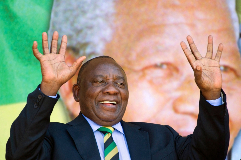 This file photo taken on February 11, 2018 shows South African Deputy President and newly-elected president of the ruling African National Congress (ANC) Cyril Ramaphosa reacting during a rally on February 11, 2018 in Cape Town. AFP / Rodger Bosch

