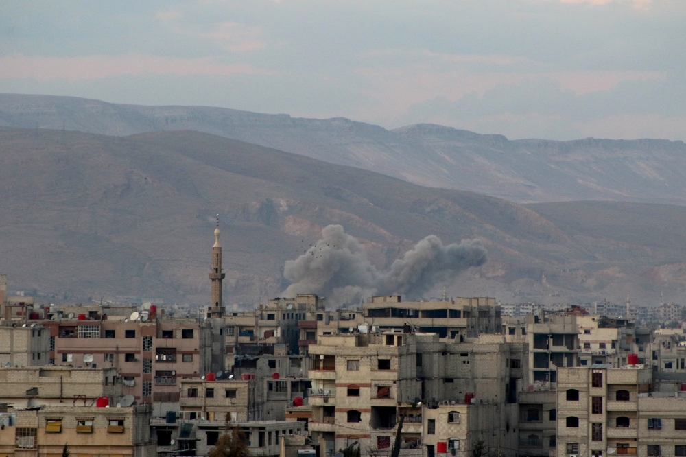 Smoke rises after Assad Regime carried out an airstrike to Arbin town of Eastern Ghouta in Damascus, Syria on February 24, 2018. Diaa Al Din - Anadolu 
