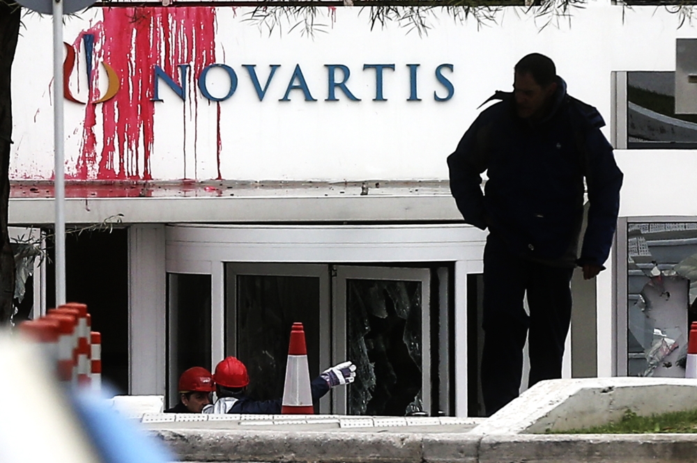 An outside view of the global healthcare company, Novartis building after a group of people from the self-proclaimed Greek anarchist group named; 'Ruvikonas' conducted a paint attack against the exterior wall of the building on February 25, 2018 in Athens