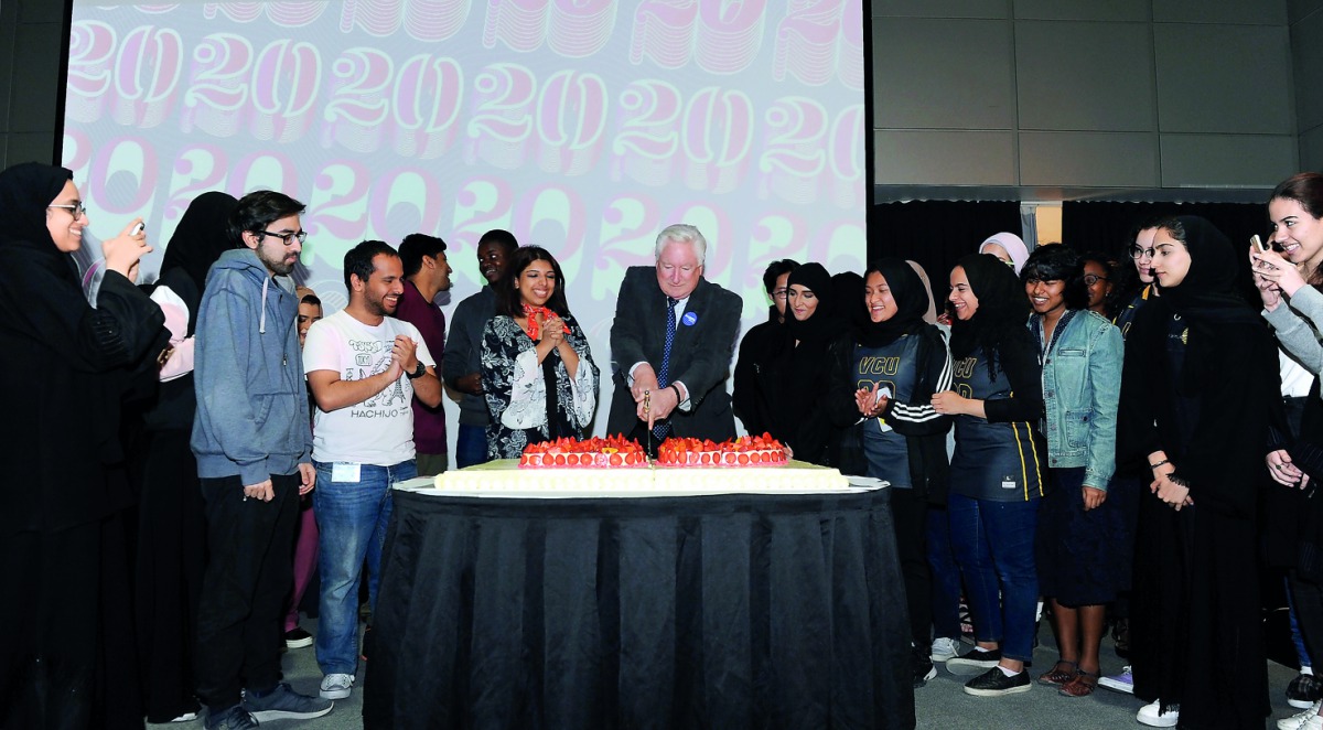 Dr Donald N Baker, Executive Dean of VCUarts Qatar (centre), with students during a cake cutting ceremony held as part of a celebration held yesterday to mark the campus’ 20 years of presence in Qatar. 
Pic: Salim Matramkot  / The Peninsula