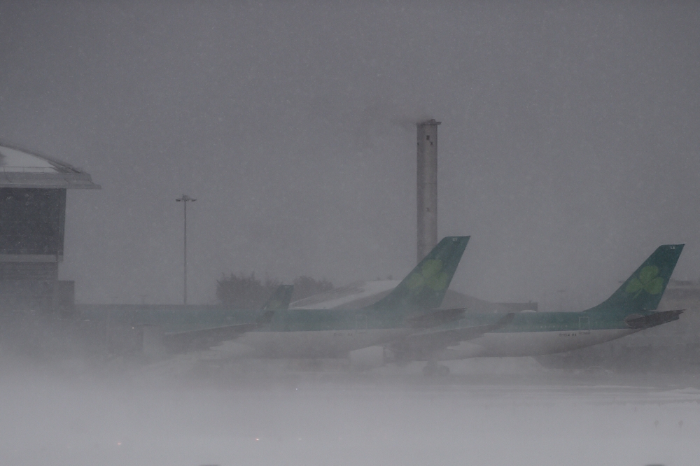 Grounded Aer Lingus planes are seen at Dublin airport during heavy snow in Dublin, Ireland, February 28, 2018. REUTERS/Clodagh Kilcoyne
