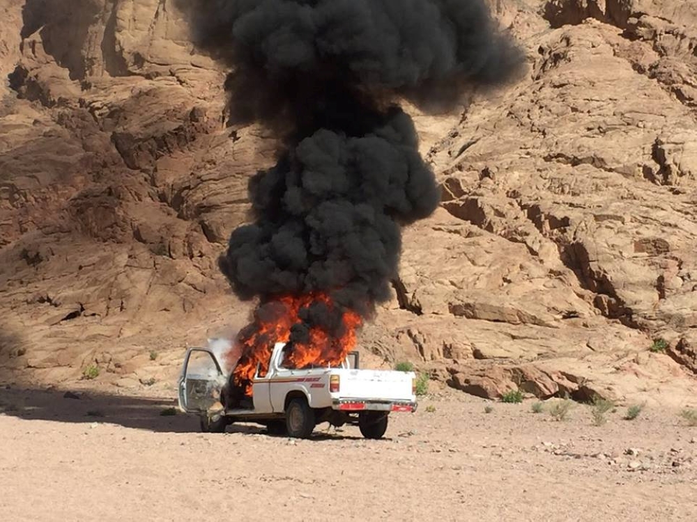 A burning vehicle is seen during a major assault against militants by Egyptian Army's soldiers in the troubled northern part of the Sinai peninsula in Al Arish, Egypt, in this undated handout picture made available by the Ministry of Defence, February 27,