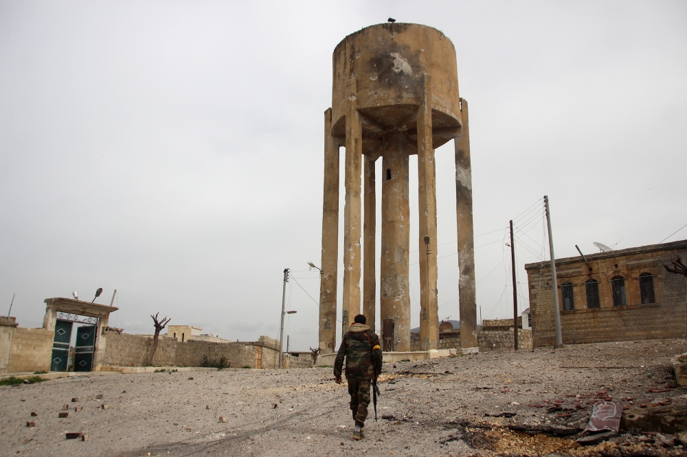 Members of Free Syrian Army (FSA), backed by Turkish Armed Forces, patrol in Haci Halil village of Afrin's northwestern Raju town. Beha El Halebi - Anadolu

