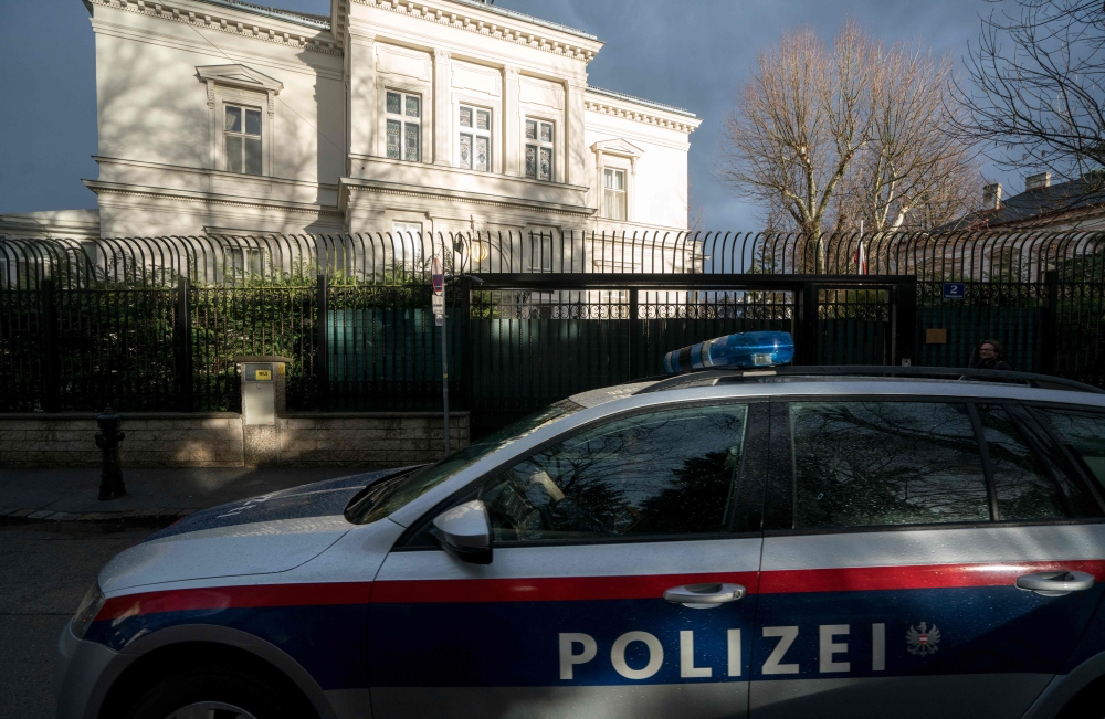 Austrian police car drives outside of the Iran ambassador's residence in Vienna, on March 12, 2018, where a 26-year-old Austrian was shot dead after he attacked a guard with a knife.  AFP / JOE KLAMAR
