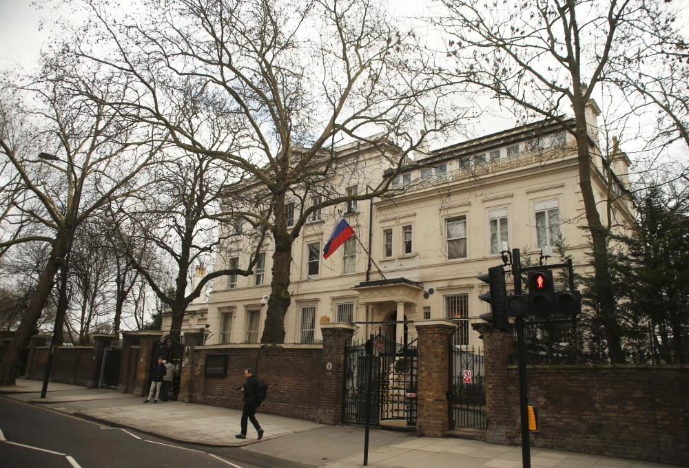 People walk past one of the entrances to Russia's embassy and consular section in London, Britain, March 13, 2018. REUTERS/Tom Jacobs