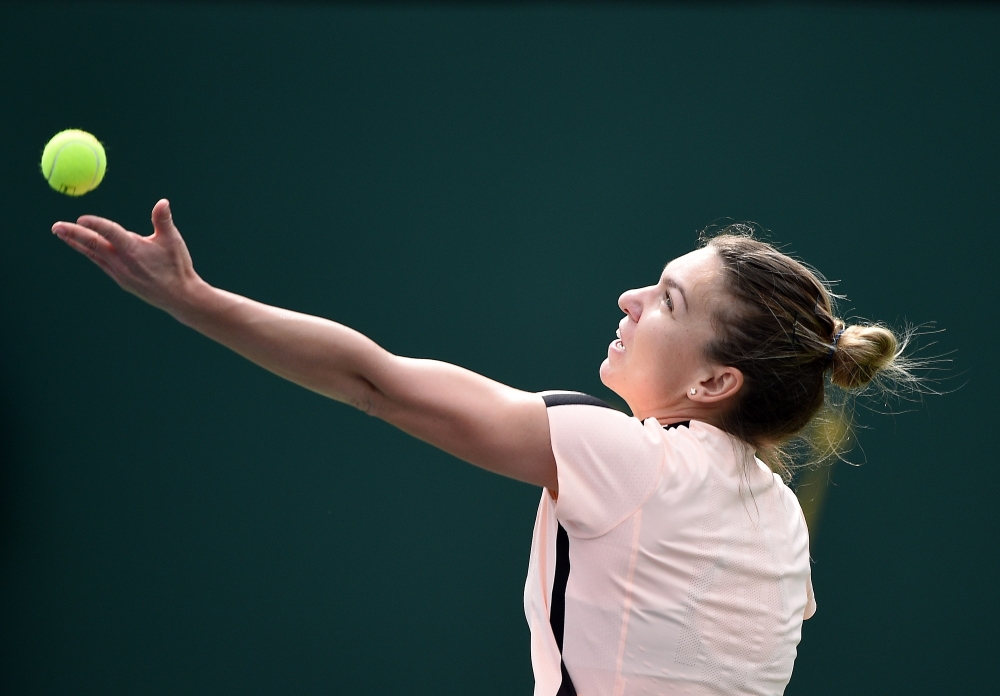 Simona Halep of Romania serves against Qiang Wang of China during Day 9 of BNP Paribas Open on March 13, 2018 in Indian Wells, California. Kevork Djansezian/Getty Images/AFP