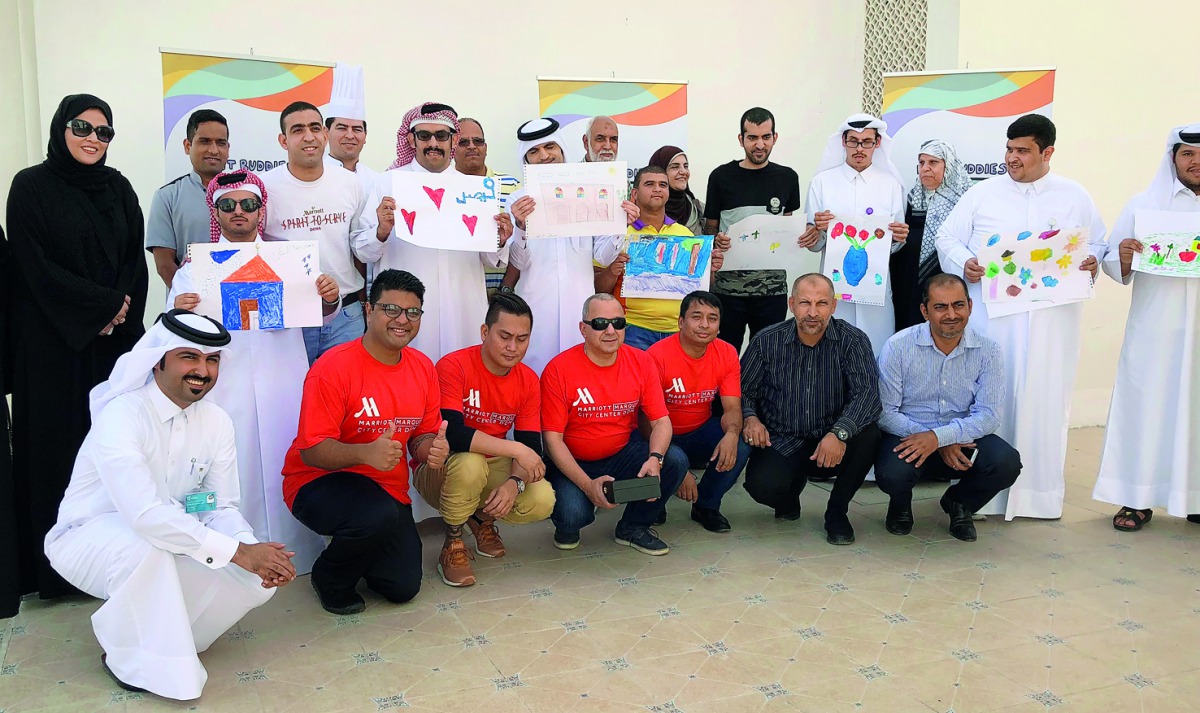The members of Best Buddies Qatar with officials during the family fun day organised  in cooperation with Marriott Marquis City Center Doha.