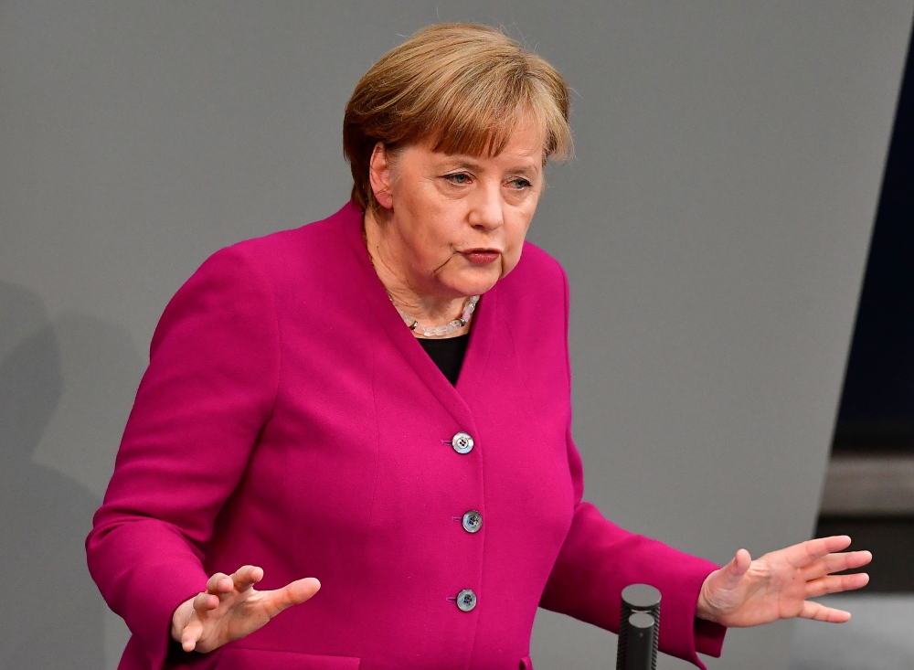 German Chancellor Angela Merkel delivers a speech to parliament on March 21, 2018 at the Bundestag (lower house of parliament) in Berlin. Merkel outlined her government's plans a week after being sworn in for a fourth term following six months of politica