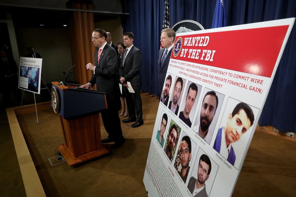 Deputy Attorney General Rod Rosenstein speaks at a press conference at the Department of Justice March 23, 2018 in Washington, DC. Win McNamee/Getty Images/AFP