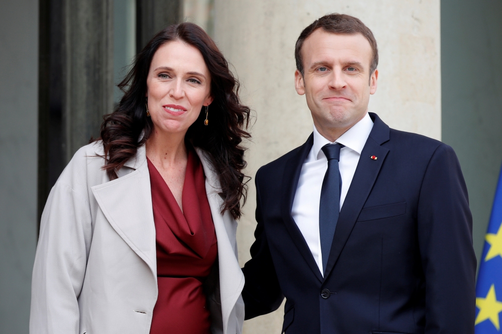 French President Emmanuel Macron (R) greets New Zealand Prime Minister Jacinda Ardern (L) upon her arrival at the Elysee Palace in Paris, France, April 16, 2018. Reuters/Charles Platiau

