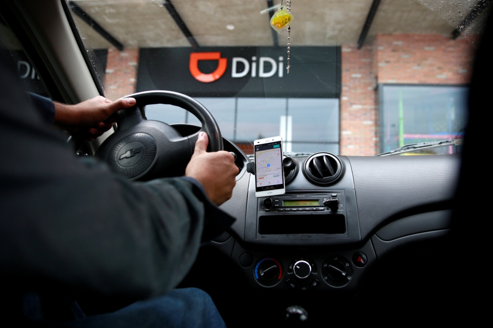 A new driver's mobile phone is seen with the app of Chinese ride-hailing firm, outside the new drivers center in Toluca, Mexico, April 23, 2018. REUTERS/Carlos Jasso