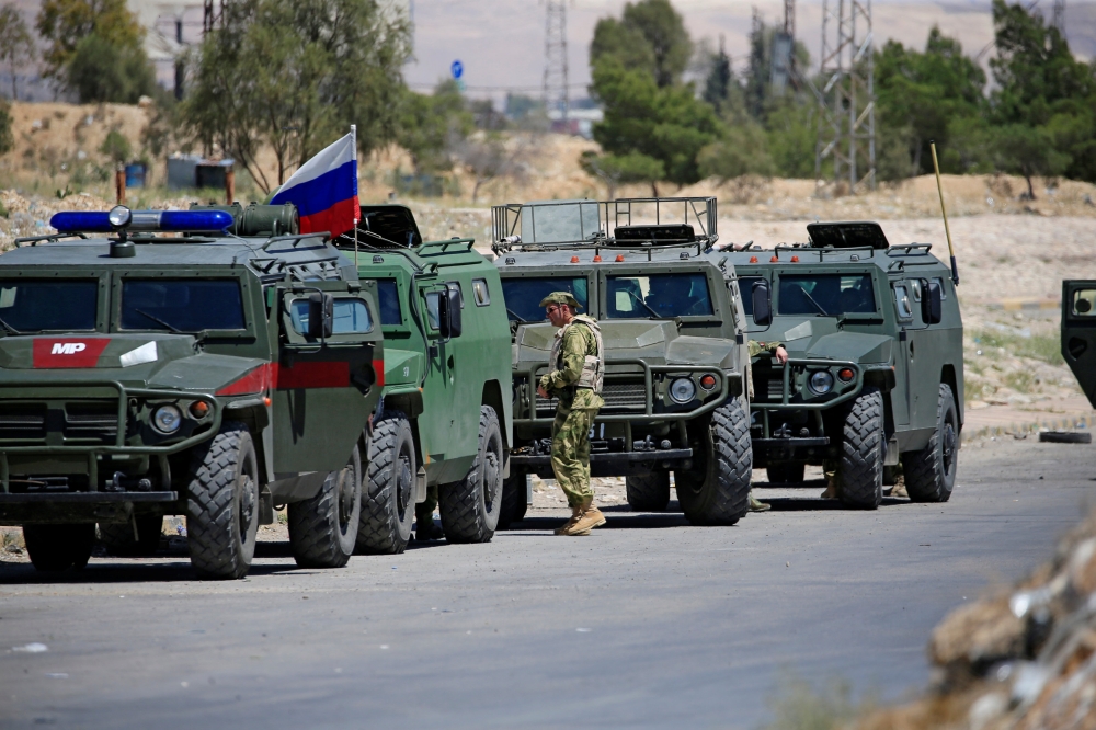 Russian military vehicles are seen in eastern Ghouta near Douma, in Damascus, Syria April 23, 2018. REUTERS/Ali Hashisho