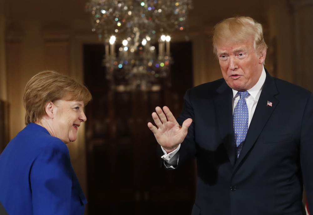 US President Donald Trump and Germany's Chancellor Angela Merkel depart after a joint news conference in the East Room of the White House in Washington April 27, 2018. Reuters/Kevin Lamarque
