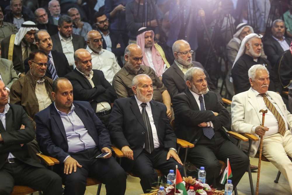 Deputy Chair of the Palestinian Legislative Committee (PLC) Ahmad Mohammad Bahar (C) attends a press conference in Gaza City, Gaza on April 29, 2018. Highest level executive body of Palestine Liberation Organization (PLO), Palestinian national council's m