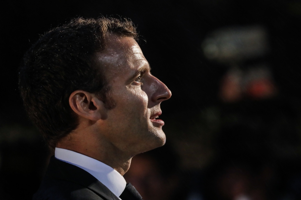 French President Emmanuel Macron delivers a speech during a traditional costume ceremony at the Jean-Marie Tjibaou cultural center in Noumea, New Caledonia, on May 5, 2018, at the end of his three-day visit to the French overseas territory. / AFP / Ludovi
