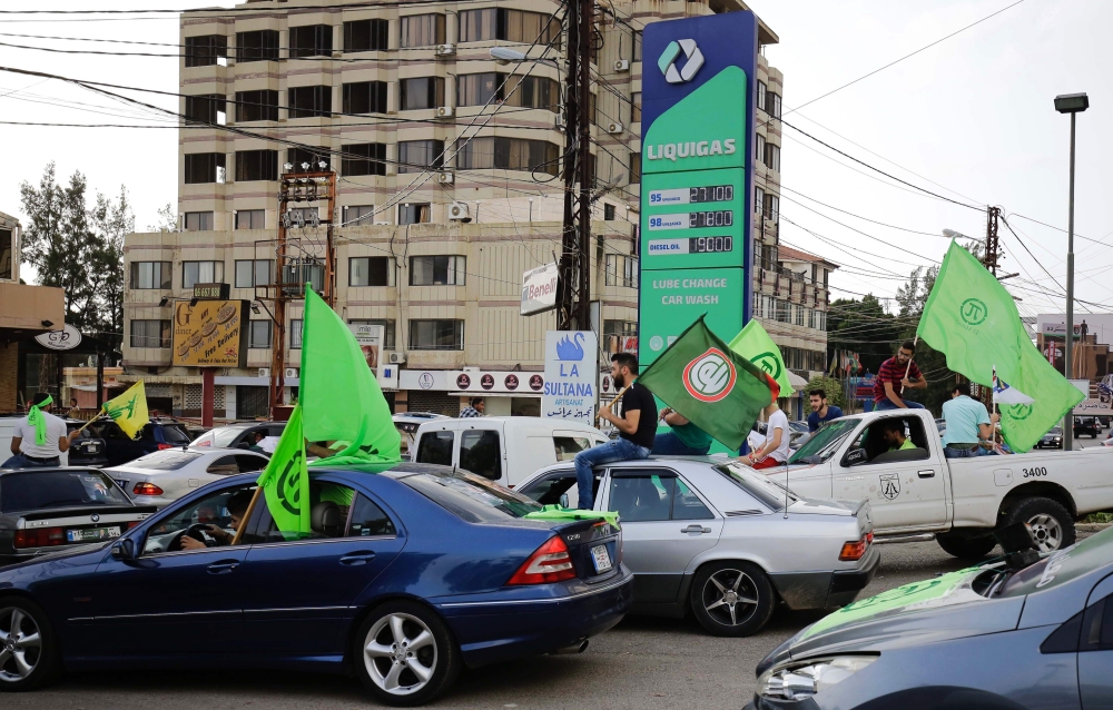 Supporters of the Marada political party parade in their cars in the northern city of Zgharta as they celebrate the parliamentary elections results on May 7, 2018. / AFP / IBRAHIM CHALHOUB