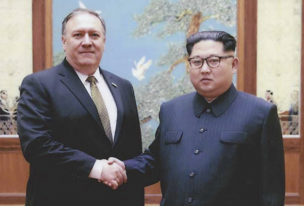 File photo released by the US Government on April 26, 2018, North Korean leader Kim Jong-Un (R) shakes hands with the former CIA Director, now US Secretary of State, Mike Pompeo in Pyongyang over the 2018 Easter weekend. AFP PHOTO / US Government/ HO 