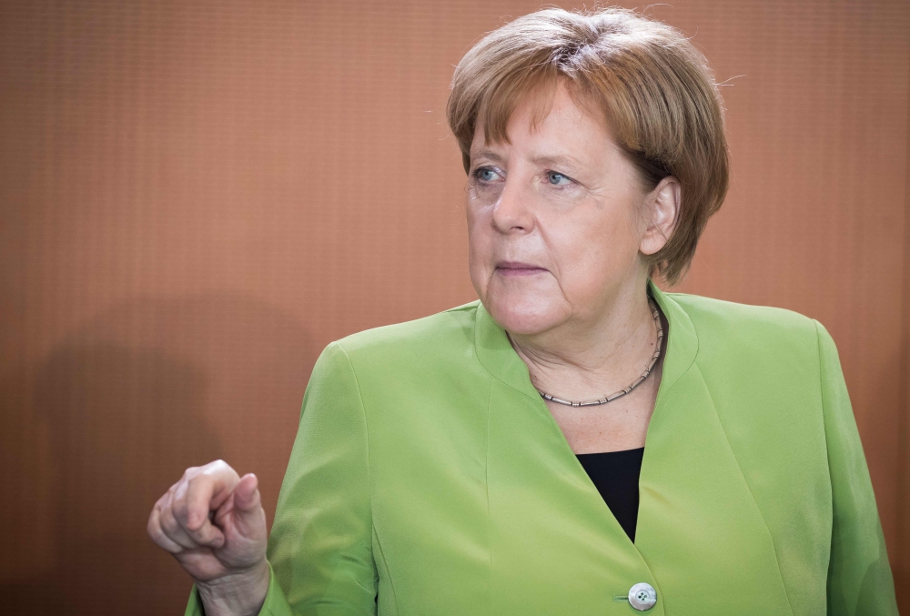 German Chancellor Angela Merkel arrives for the weekly cabinet meeting at the Chancellery in Berlin on May 9, 2018. / AFP / Odd ANDERSEN