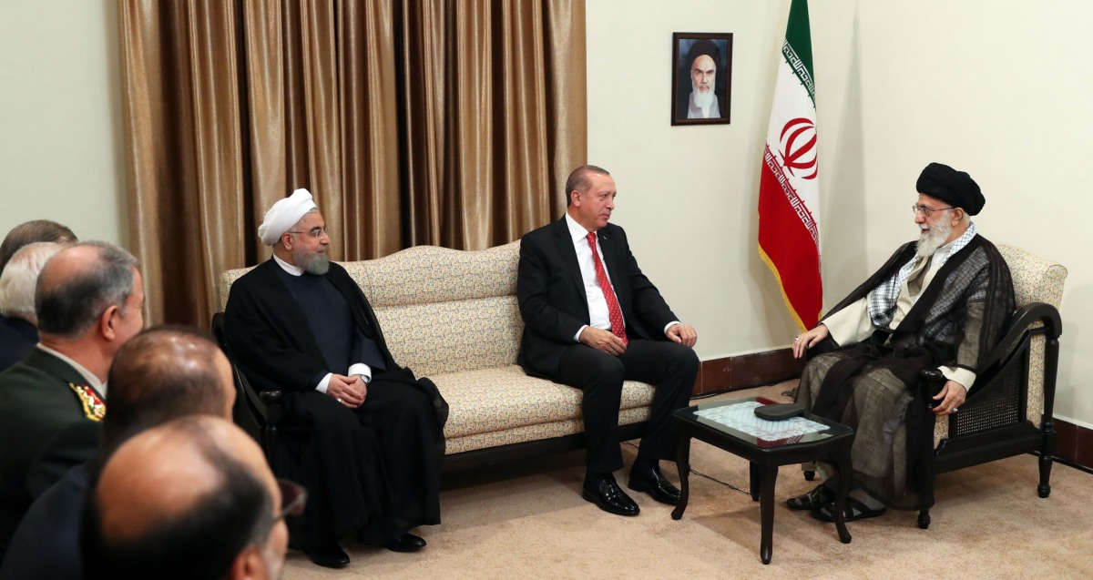 FILE PHOTO: A handout photo provided by the office of Iran supreme leader Ayatollah Ali Khamenei shows himand President Hassan Rouhani meeting with Turkish President Recep Tayyip Erdogan on October 4, 2017 (AFP) 