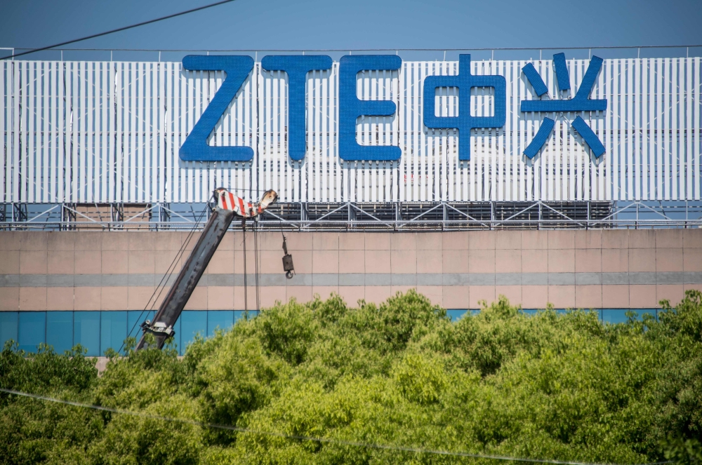 This picture taken on May 3, 2018 shows the ZTE logo on an office building in Shanghai. AFP / Johannes Eisele 