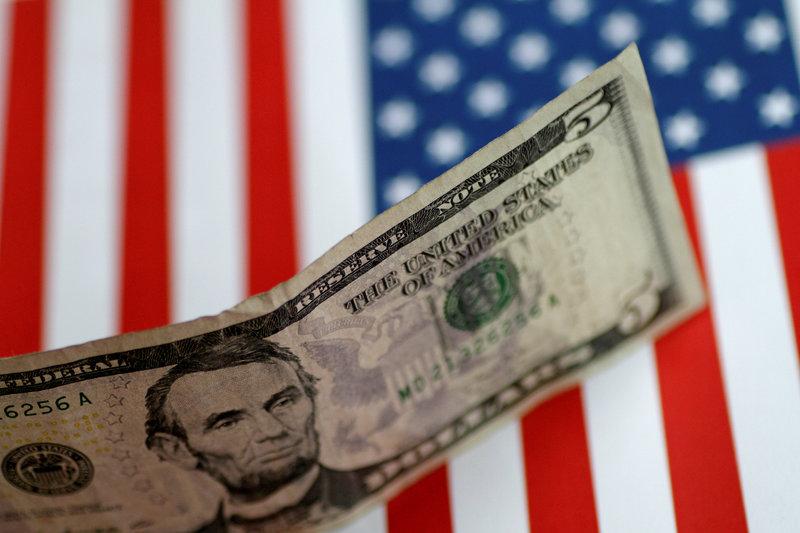 FILE PHOTO: A US five dollar note is seen in this illustration photo, June 1, 2017. Reuters/Thomas White