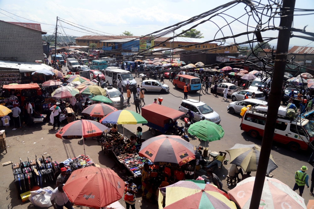 People and traffic are seen along a street in Ngaba commune of Kinshasa, Democratic Republic of Congo May 18, 2018. Reuters/Kenny Katombe