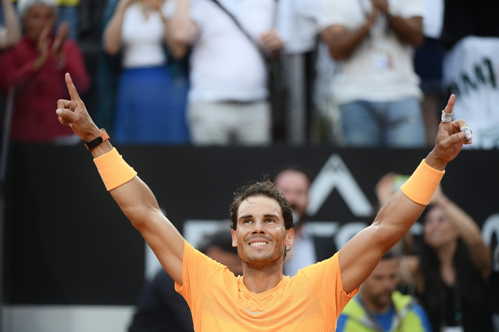 Spain's Rafael Nadal celebrates after winning the Men's final against Germany's Alexander Zverev at Rome's ATP Tennis Open tournament at the Foro Italico, on May 20, 2018 in Rome. / AFP / Filippo MONTEFORTE