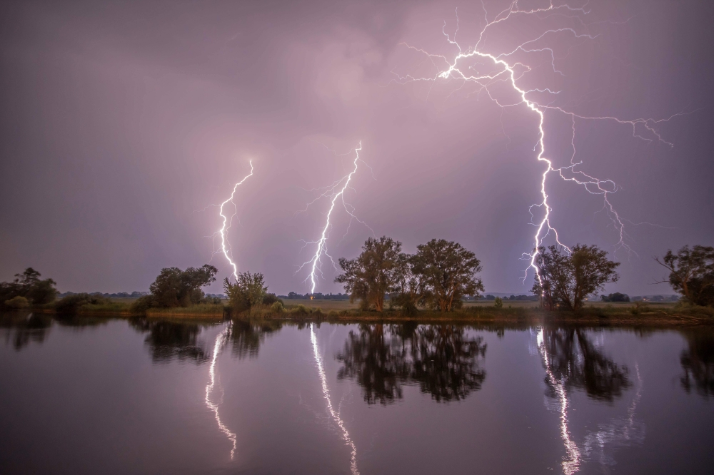 A picture taken on May 27, 2018 shows thunderbolts in the night sky in Premnitz, northwestern Germany. - Germany OUT / AFP / dpa / Julian St