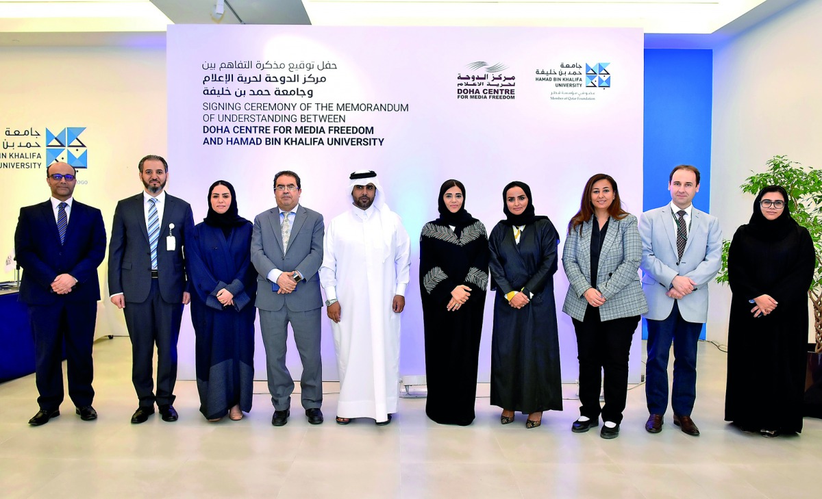 The officials of Hamad Bin Khalifa University and the Doha Center for Media Freedom during the signing of Memorandum of Understanding and a Translation Services Agreement.
