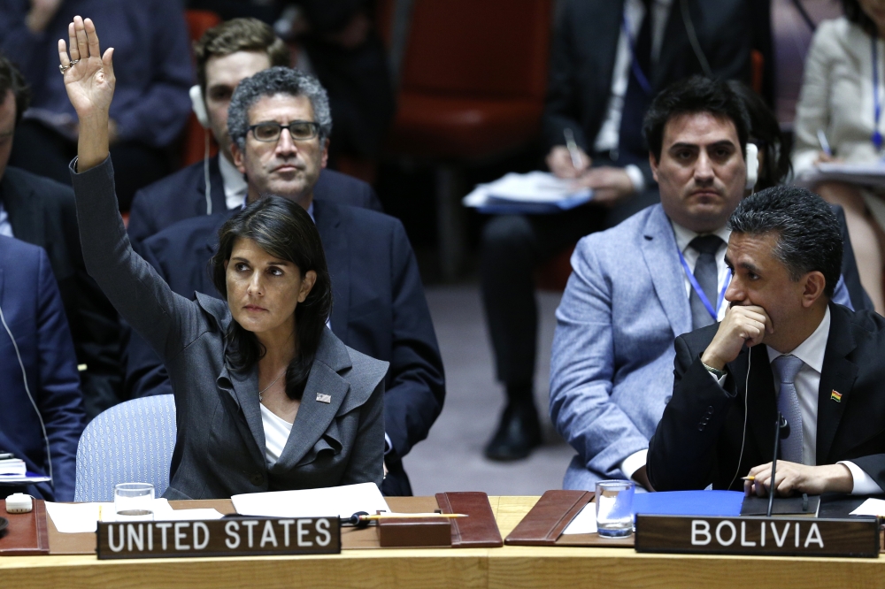 United States Ambassador to the United Nations, Nikki Haley (L) votes during the Security Council meeting on the situation in the Middle East including the Question of Palestine at the United Nations Headquarters in New York, United States on June 01, 201