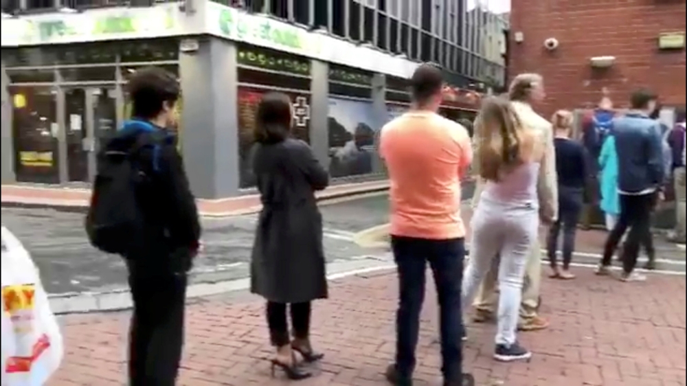 People queue at an ATM in Dublin, Ireland, in this still image obtained from social media video June 1, 2018. TWITTER / @CJSTARRY/via REUTERS 