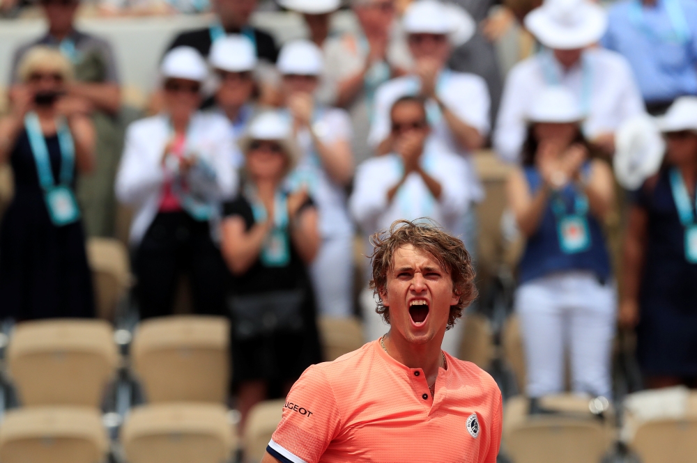Germany's Alexander Zverev celebrates winning his fourth round match against Russia's Karen Khachanov. (REUTERS/Gonzalo Fuentes)