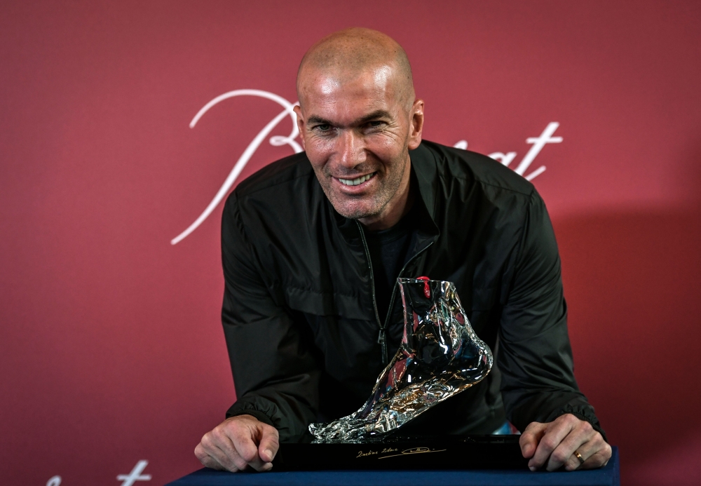 Former French football player and European Leukodystrophy Association (ELA) patron Zinedine Zidane poses with the 