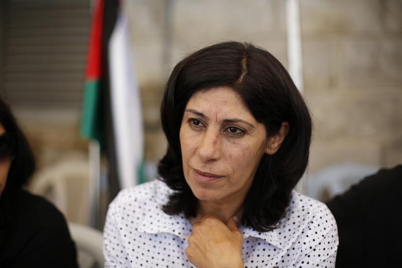
Khalida Jarrar, a Palestinian Member of Parliament (MP) from Ramallah, speaks during an interview with Reuters at her solidarity tent erected outside the headquarters of the Palestinian parliament in the West Bank city of Ramallah August 21, 2014. (Reut