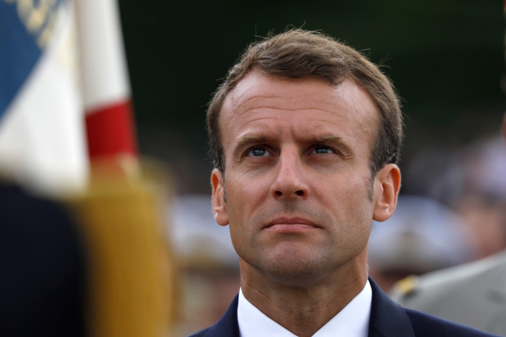 French President Emmanuel Macron attends a ceremony commemorating General Charles De Gaulle's June 1940 appeal for French resistance against Nazi Germany, at the Mont Valerien National Memorial in Suresnes on the outskirts of Paris on June 18, 2018. / AFP