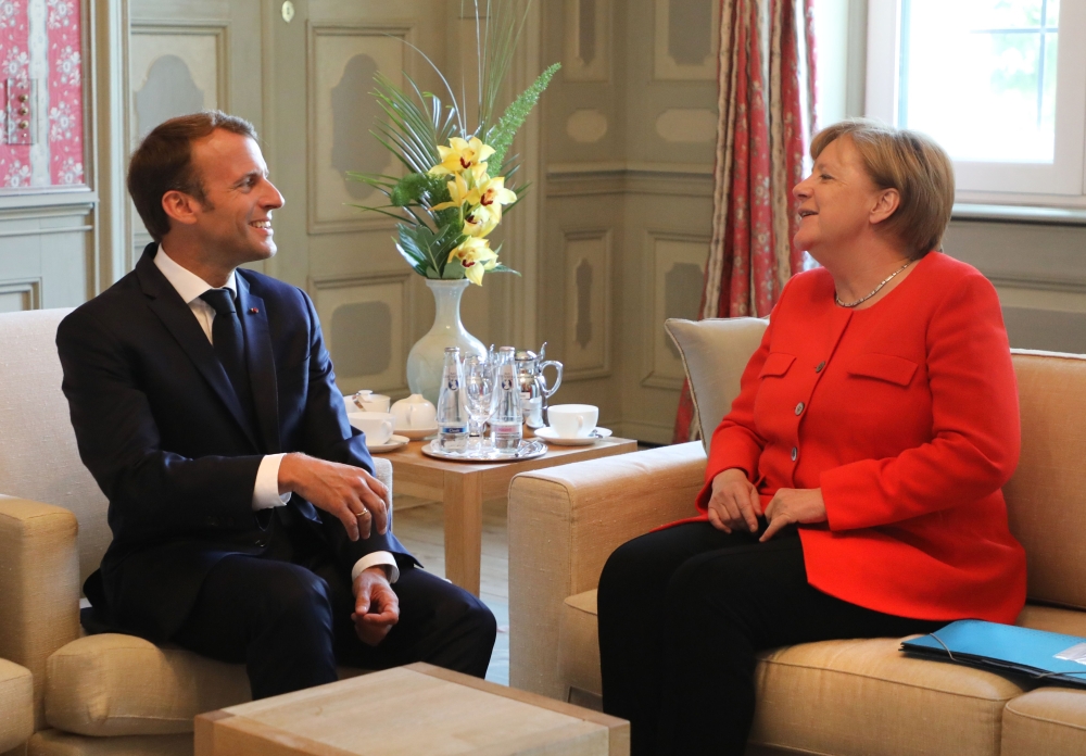 German Chancellor Angela Merkel and French President Emmanuel Macron hold bilateral talks on June 19, 2018, at the Meseberg Palace, north of Berlin, during a ministerial conference to coordinate European reform proposals ahead of EU summit on June 28-29, 