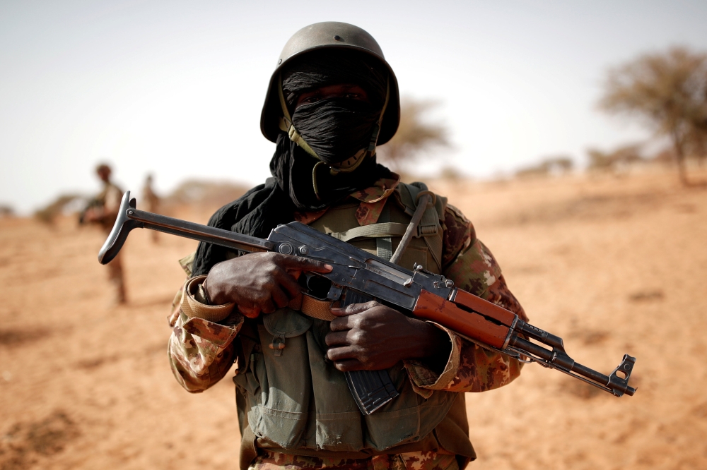 File photo of a Malian soldier near Tin Hama, Mali, October 20, 2017. REUTERS/Benoit Tessier 
