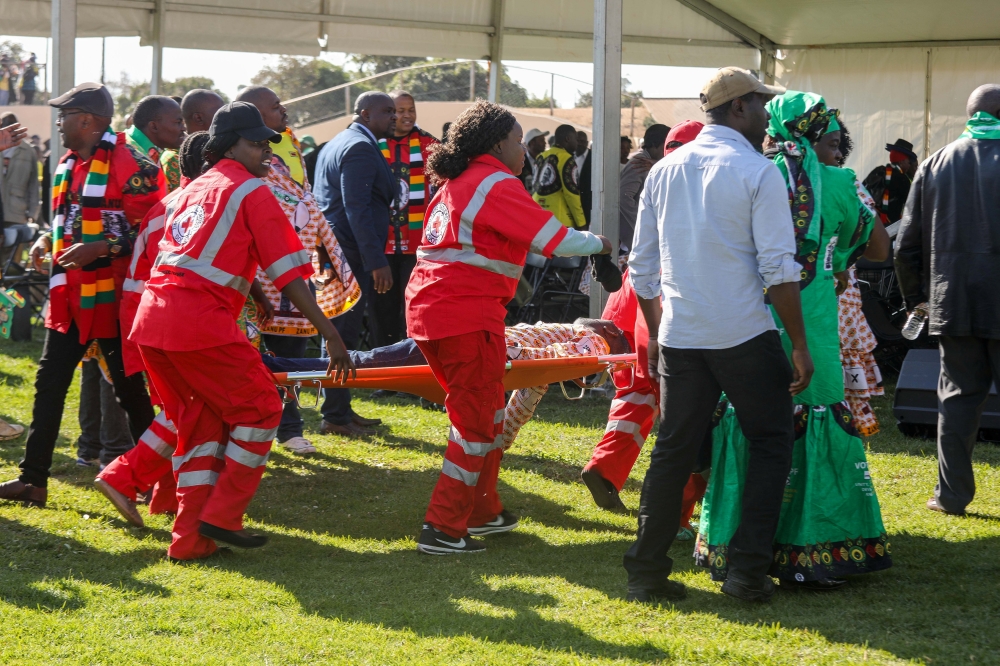 Medics attend to people injured in an explosion during a rally by Zimbabwean President Emmerson Mnangagwa in Bulawayo, Zimbabwe June 23, 2018. Tafadzwa Ufumeli/REUTERS 
