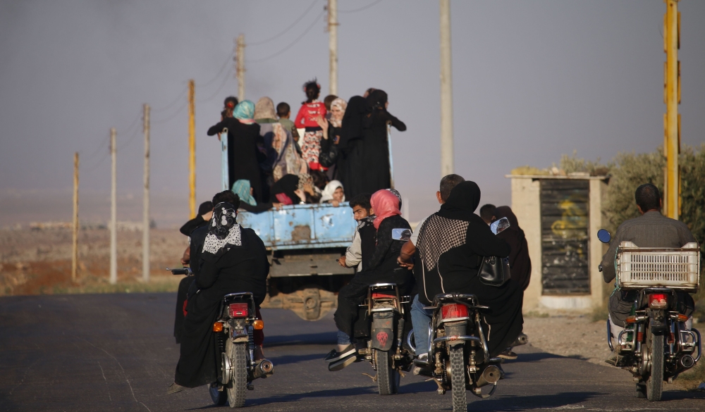 Syrian families return to their homes in towns and villages situated on the southern outskirts of Daraa on June 6, 2018. The Syrian regime reached a ceasefire deal with rebels in the country's south, the official SANA news agency said. AFP / Mohamad Abaze