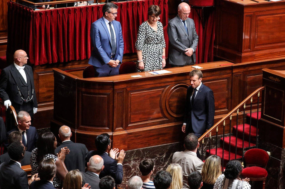 French President Emmanuel Macron leaves after addressing a special congress gathering both houses of Parliament (National Assembly and Senate) at the congress hemicycle room in the Palace of Versailles, outside Paris, on July 9, 2018.  AFP / ludovic Marin