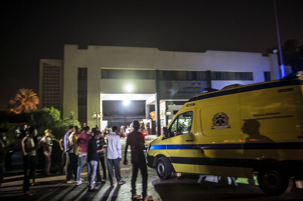 An ambulance arrives to the Heliopolis petrochemical company after a strong explosion occurred in a chemical tank near the Cairo airport late on July 12, 2018, leaving a dozen wounded. AFP / Khaled Desouki 
