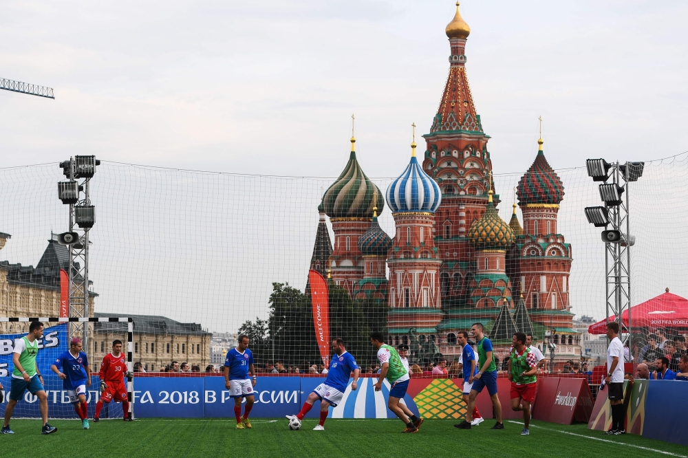France and Croatia fans play a friendly match at the Red Square in Moscow on July 14, 2018 on the eve of the Russia 2018 World Cup final football match between France and Croatia. (AFP / Jewel SAMAD)