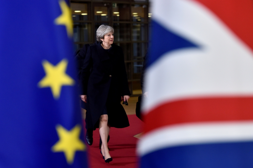 FILE PHOTO: British Prime Minister Theresa May arrives for the EU summit in Brussels, Belgium, December 14, 2017. REUTERS/Eric Vidal/File Photo